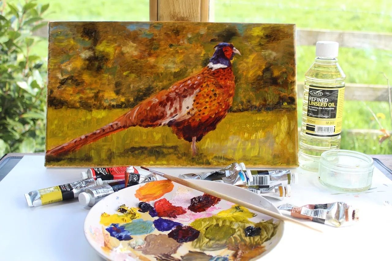 Atelier malarza z paletą barw i obrazem na sztaludze — rzemiosło jako środowisko autoteliczne